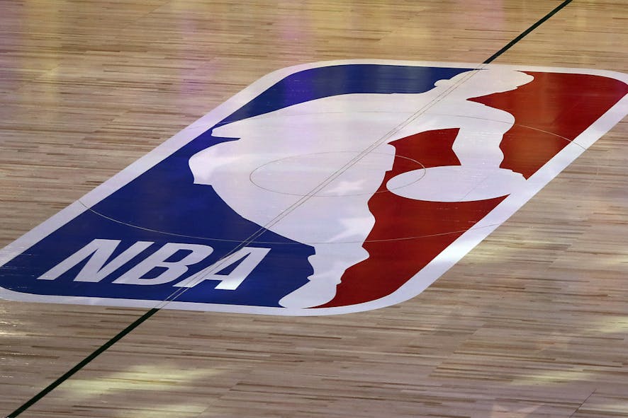 FILE - An NBA logo is seen at center