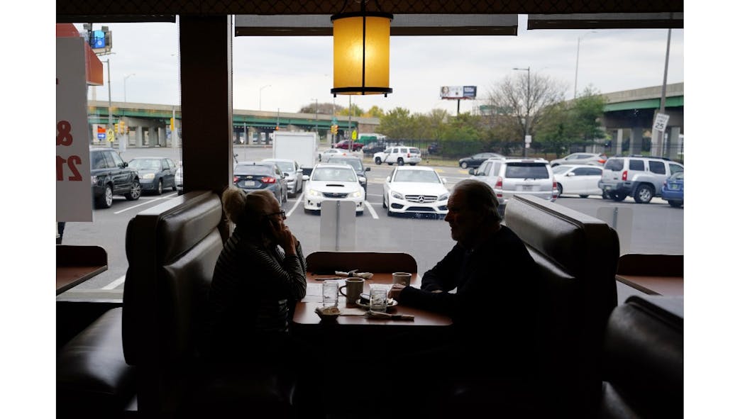 Customers In A Booth At Restaurant