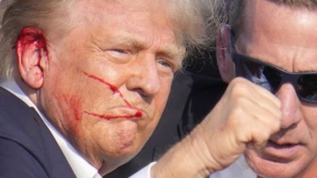 Trump with blood on his face - July 13, 2024